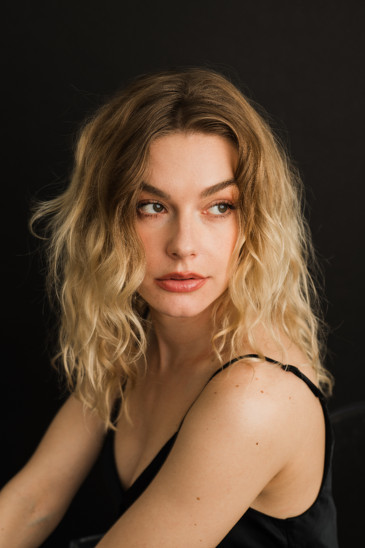 Editorial portrait of model with wavy blonde hair